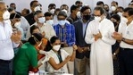 Madhura Patil, a health worker, gestures as she receives COVID-19 vaccine in the presence of Uddhav Thackeray, standing in white dress, Chief Minister of Maharashtra State in Mumbai, India, Saturday, Jan. 16, 2021. India started inoculating health workers Saturday in what is likely the world's largest COVID-19 vaccination campaign, joining the ranks of wealthier nations where the effort is already well underway. (AP Photo/Rajanish Kakade)(AP) Madhura Patil, a health worker, gestures as she receives COVID-19 vaccine in the presence of Uddhav Thackeray, standing in white dress, Chief Minister of Maharashtra State in Mumbai, India, Saturday, Jan. 16, 2021. India started inoculating health workers Saturday in what is likely the world's largest COVID-19 vaccination campaign, joining the ranks of wealthier nations where the effort is already well underway. (AP Photo/Rajanish Kakade)(AP)