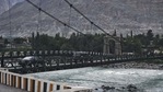 Vehicles cross a wooden plank cable suspension bridge over the Indus river in Gilgit.(Reuters file) Vehicles cross a wooden plank cable suspension bridge over the Indus river in Gilgit.(Reuters file)