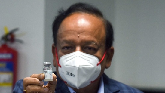 Union health minister Harsh Vardhan shows a dose of Covaxin developed by Bharat Biotech at AIIMS in New Delhi on Saturday as the first phase of vaccination begins across the country. (ANI Photo) Union health minister Harsh Vardhan shows a dose of Covaxin developed by Bharat Biotech at AIIMS in New Delhi on Saturday as the first phase of vaccination begins across the country. (ANI Photo)