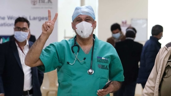 Dr Sandeep Nayar, the first beneficiary of Covishield vaccine, developed by Oxford-AstraZeneca Plc. and manufactured by Serum Institute of India Ltd, gestures at the BL Kapoor Super Specialty Hospital in New Delhi on Saturday. Bloomberg Dr Sandeep Nayar, the first beneficiary of Covishield vaccine, developed by Oxford-AstraZeneca Plc. and manufactured by Serum Institute of India Ltd, gestures at the BL Kapoor Super Specialty Hospital in New Delhi on Saturday. Bloomberg