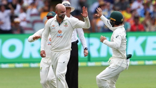 Australia's Nathan Lyon, left, is congratulated by teammate Matthew Wade after taking the wicket of India's Rohit Sharma during play on day two of the fourth cricket Test between India and Australia at the Gabba, Brisbane, Australia, Saturday, Jan. 16, 2021.(AP) Australia's Nathan Lyon, left, is congratulated by teammate Matthew Wade after taking the wicket of India's Rohit Sharma during play on day two of the fourth cricket Test between India and Australia at the Gabba, Brisbane, Australia, Saturday, Jan. 16, 2021.(AP)