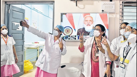 Health workers take a selfie during Prime Minister Narendra Modi's speech on the first day of a pan-India Covid-19 vaccination drive, at Rajawadi Hospital in Mumbai on Saturday. (Satish Bate/HT Photo) Health workers take a selfie during Prime Minister Narendra Modi's speech on the first day of a pan-India Covid-19 vaccination drive, at Rajawadi Hospital in Mumbai on Saturday. (Satish Bate/HT Photo)