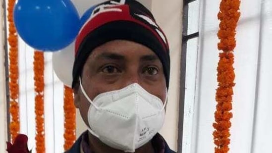 Ram Babu, a sanitary attendant at the Indira Gandhi Institute of Medical Sciences, IGIMS, displaying the certificate he received after taking the first shot of vaccine against coronavirus, in Patna on Saturday.(HT photo) Ram Babu, a sanitary attendant at the Indira Gandhi Institute of Medical Sciences, IGIMS, displaying the certificate he received after taking the first shot of vaccine against coronavirus, in Patna on Saturday.(HT photo)
