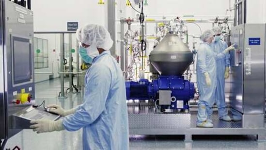 Scientists work with a bioreactor at a company facility in New York state, for efforts on an experimental coronavirus antibody drug.(AP) Scientists work with a bioreactor at a company facility in New York state, for efforts on an experimental coronavirus antibody drug.(AP)