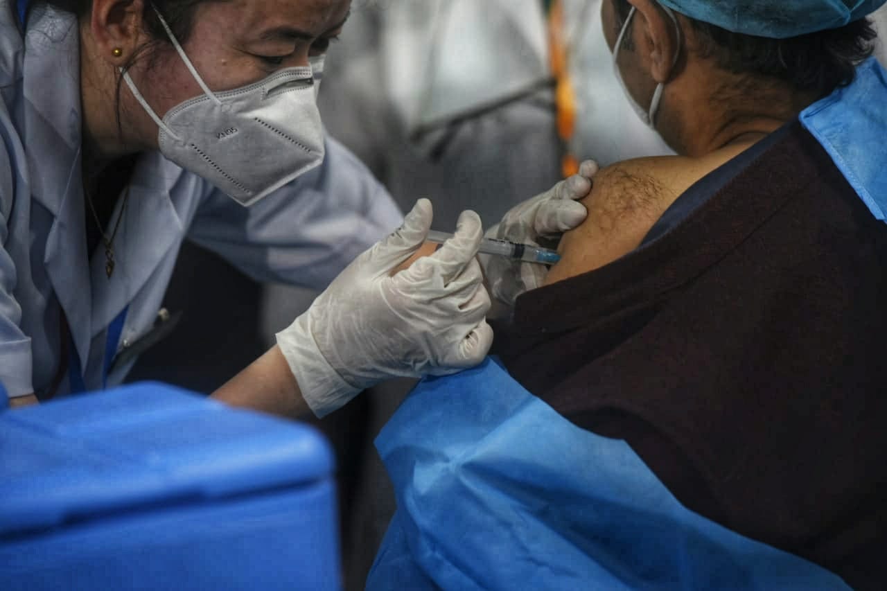 Vaccine is administered inside the vaccination center during the vaccination process at AIIMS Hospital in New Delhi. (HT Photo/ Amal KS)