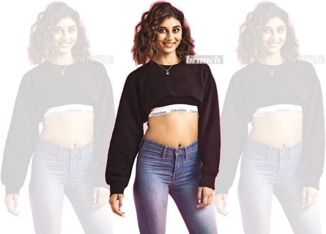 Dolly says that she was bullied for being thin as a young girl, which makes coping with negative comments online easier; Sweatshirt, DIY; sports bra, Calvin Klein; jeans, H&M.(Shivamm Paathak ) Dolly says that she was bullied for being thin as a young girl, which makes coping with negative comments online easier; Sweatshirt, DIY; sports bra, Calvin Klein; jeans, H&M.(Shivamm Paathak )