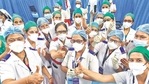 Medical workers congratulate their colleague senior staff nurse after she got the first Covid-19 vaccine shot at KEM Hospital in Mumbai on Saturday. (Anshuman Poyrekar/HT Photo) Medical workers congratulate their colleague senior staff nurse after she got the first Covid-19 vaccine shot at KEM Hospital in Mumbai on Saturday. (Anshuman Poyrekar/HT Photo)