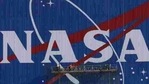 Painters refurbish the NASA logo on the Vehicle Assembly Building at the Kennedy Space Center in Florida.(AFP)