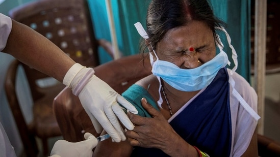 A healthcare worker reacts as she receives a dose of Covid-19 vaccine at Mathalput Community Health Centre in Koraput district of Odisha. (Reuters File Photo )