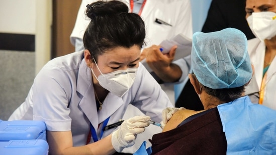 A health worker receives a Covid-19 vaccine shot, at AIIMS in New Delhi on Saturday. (ANI Photo) A health worker receives a Covid-19 vaccine shot, at AIIMS in New Delhi on Saturday. (ANI Photo)