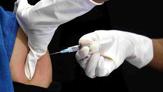 A nurse administers the Covid-19 vaccine to a frontline worker after the virtual launch of vaccination drive at a Hospital in Kolkata.(ANI) A nurse administers the Covid-19 vaccine to a frontline worker after the virtual launch of vaccination drive at a Hospital in Kolkata.(ANI)
