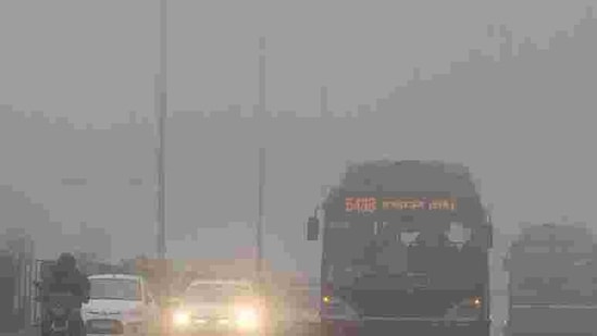 Traffic moves slowly through a dense fog in New Delhi. Cold wave conditions continued across North India claiming 165 lives this winter. AFP PHOTO / Prakash Singh Traffic moves slowly through a dense fog in New Delhi. Cold wave conditions continued across North India claiming 165 lives this winter. AFP PHOTO / Prakash Singh
