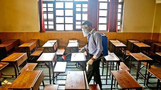 A classroom at Mount Abu School in Rohini being sanitised, a day before schools in Delhi resume in-person sessions for students of classes 10 and 12.( anchit Khanna/HT PHOTO)