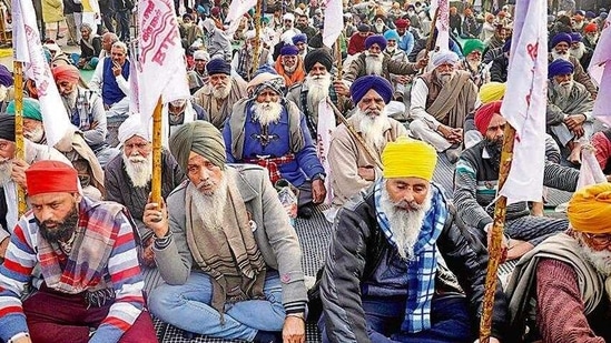 Farmers during the ongoing protest against the new agriculture laws at Delhi’s Singhu border on Sunday.