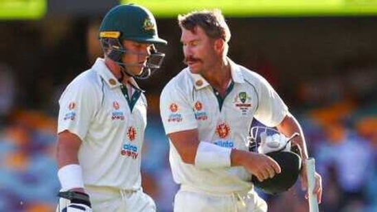 Australia's David Warner, right, and opening partner Marcus Harris walk from the field at the end of play on day three of the fourth cricket test between India and Australia at the Gabba, Brisbane, Australia.
