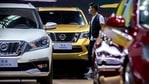 A visitor wearing a face mask to protect against the coronavirus walks among vehicles from Nissan at the Beijing International Automotive Exhibition in Beijing. China.(AP/ File) A visitor wearing a face mask to protect against the coronavirus walks among vehicles from Nissan at the Beijing International Automotive Exhibition in Beijing. China.(AP/ File)