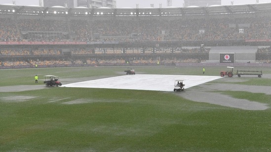 Water is seen pooling on the surface near the wicket during a rain delay on day two of the fourth test match between Australia and India at the Gabba in Brisbane, Australia, January 16, 2021. AAP Image/Darren England via REUTERS ATTENTION EDITORS - THIS IMAGE WAS PROVIDED BY A THIRD PARTY. NO RESALES. NO ARCHIVE. AUSTRALIA OUT. NEW ZEALAND OUT(via REUTERS)