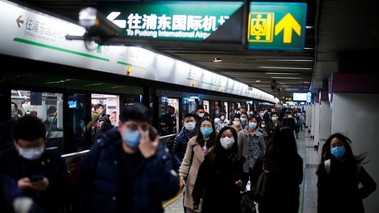 People wearing face masks are seen at a subway station following the coronavirus disease (Covid-19) outbreak, in Shanghai, China. (REUTERS)