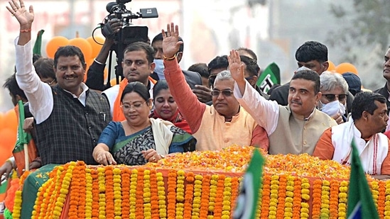 BJP leaders Dilip Ghosh and Subhendu Adhikar waves to supporters during a public rally, in Kolkata on Monday. (ANI Photo) BJP leaders Dilip Ghosh and Subhendu Adhikar waves to supporters during a public rally, in Kolkata on Monday. (ANI Photo)