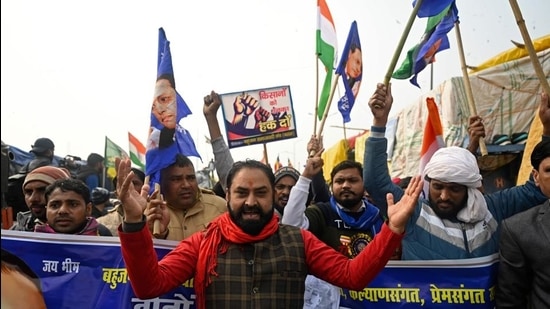 Supporters of farmers take part in a flag march along a blocked highway as farmers continue to protest against the central government's recent agricultural reforms at the Delhi-Uttar Pradesh state border in Ghazipur on January 17. (AFP) Supporters of farmers take part in a flag march along a blocked highway as farmers continue to protest against the central government's recent agricultural reforms at the Delhi-Uttar Pradesh state border in Ghazipur on January 17. (AFP)