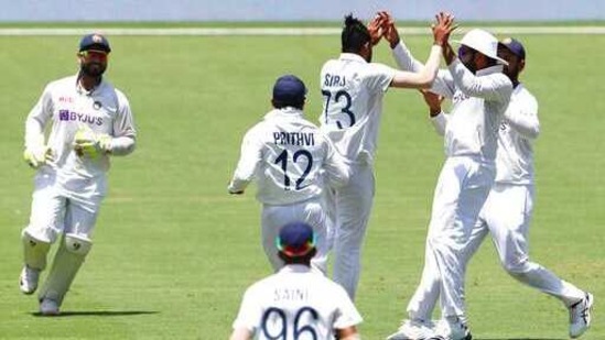 India's Mohammed Siraj, centre, is congratulated by teammates after dismissing Australia's Matthew Wade during play on day four of the fourth cricket test between India and Australia at the Gabba, Brisbane.(AP) India's Mohammed Siraj, centre, is congratulated by teammates after dismissing Australia's Matthew Wade during play on day four of the fourth cricket test between India and Australia at the Gabba, Brisbane.(AP)