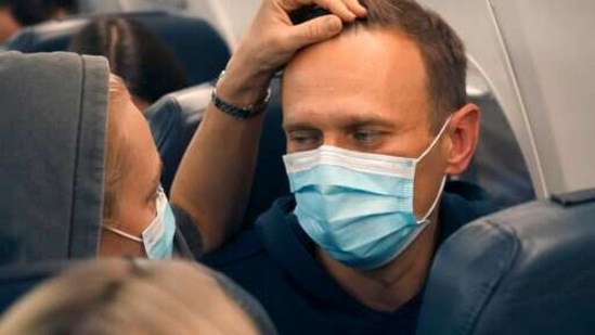 Alexei Navalny and his wife Yulia sit on the plane on a flight to Moscow, at the Airport Berlin Brandenburg in Schoenefeld, Germany.(AP) Alexei Navalny and his wife Yulia sit on the plane on a flight to Moscow, at the Airport Berlin Brandenburg in Schoenefeld, Germany.(AP)