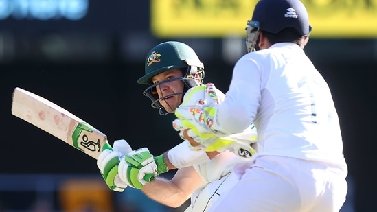 Australia's captain Tim Paine plays a shot on day one of the fourth cricket Test match between Australia and India at The Gabba in Brisbane on January 15, 2021. (Photo by Patrick HAMILTON / AFP) / --IMAGE RESTRICTED TO EDITORIAL USE - STRICTLY NO COMMERCIAL USE-- (AFP)