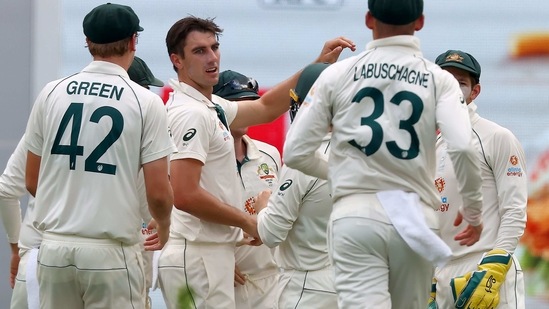 Australia's paceman Pat Cummins (C) celebrates his wicket of Indian batsman Shubman Gill with teammates on day two of the fourth cricket Test match between Australia and India at the Gabba in Brisbane on January 16, 2021. (Photo by Patrick HAMILTON / AFP) / --IMAGE RESTRICTED TO EDITORIAL USE - STRICTLY NO COMMERCIAL USE--(AFP)