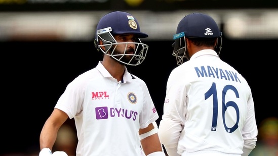 India's captain Ajinkya Rahane (L) talks to teammate Mayank Agarwal between the overs on day three of the fourth cricket Test match between Australia and India at the Gabba in Brisbane on January 17, 2021. (Photo by Patrick HAMILTON / AFP) / --IMAGE RESTRICTED TO EDITORIAL USE - STRICTLY NO COMMERCIAL USE-- (AFP) India's captain Ajinkya Rahane (L) talks to teammate Mayank Agarwal between the overs on day three of the fourth cricket Test match between Australia and India at the Gabba in Brisbane on January 17, 2021. (Photo by Patrick HAMILTON / AFP) / --IMAGE RESTRICTED TO EDITORIAL USE - STRICTLY NO COMMERCIAL USE-- (AFP)