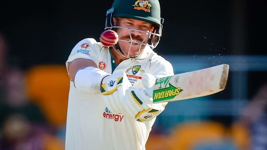 Australia's David Warner plays a shot during day three of the fourth cricket Test match between Australia and India at the Gabba in Brisbane on January 17, 2021. (Photo by Patrick HAMILTON / AFP) / -- IMAGE RESTRICTED TO EDITORIAL USE - STRICTLY NO COMMERCIAL USE -- (AFP) Australia's David Warner plays a shot during day three of the fourth cricket Test match between Australia and India at the Gabba in Brisbane on January 17, 2021. (Photo by Patrick HAMILTON / AFP) / -- IMAGE RESTRICTED TO EDITORIAL USE - STRICTLY NO COMMERCIAL USE -- (AFP)