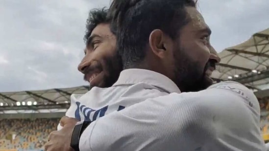Jasprit Bumrah hugged Mohammed Siraj as he led the team back. (BCCI screengrab)