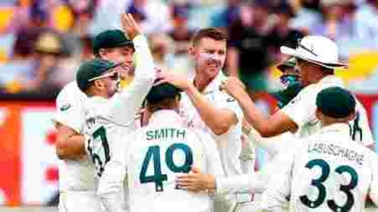 Australia's Josh Hazlewood, centre, is congratulated by teammates after dismissing India's Mayank Agarwal during play on day three of the fourth cricket test between India and Australia at the Gabba, Brisbane, Australia, Sunday, Jan. 17, 2021. (AP Photo/Tertius Pickard)) (AP) Australia's Josh Hazlewood, centre, is congratulated by teammates after dismissing India's Mayank Agarwal during play on day three of the fourth cricket test between India and Australia at the Gabba, Brisbane, Australia, Sunday, Jan. 17, 2021. (AP Photo/Tertius Pickard)) (AP)
