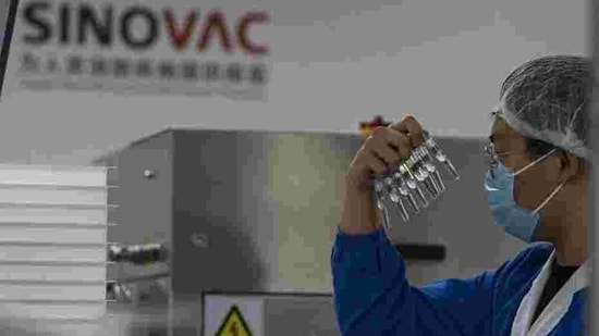 Brazilian researchers announced last week that the vaccine's overall efficacy was 50.4% based on results from more than 9,000 volunteers, most of whom received doses 14 days apart, as outlined in the trial protocol.(AP) Brazilian researchers announced last week that the vaccine's overall efficacy was 50.4% based on results from more than 9,000 volunteers, most of whom received doses 14 days apart, as outlined in the trial protocol.(AP)