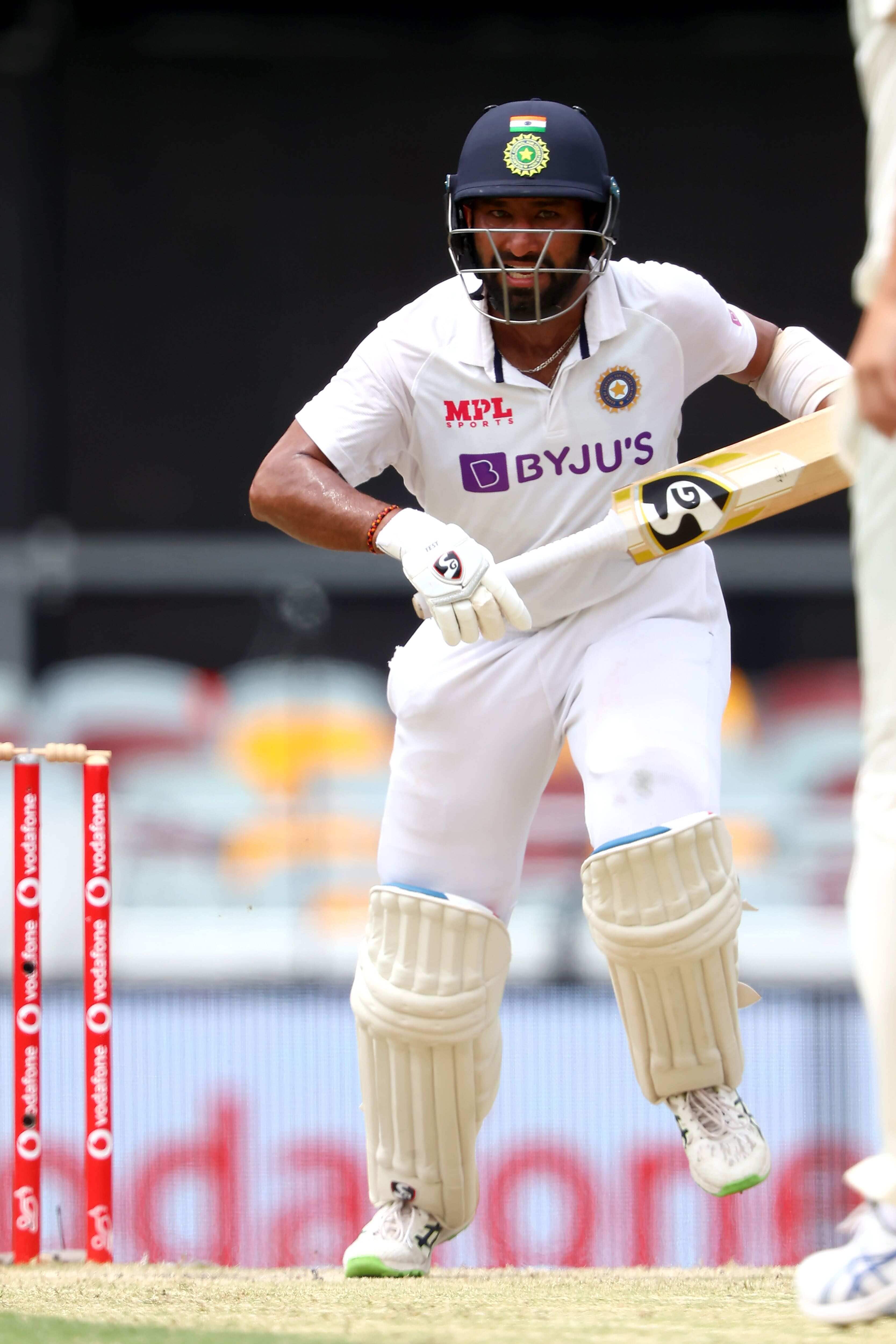 India's batsman Cheteshwar Pujara runs between the wickets on day three of the fourth cricket Test match between Australia and India at the Gabba in Brisbane on January 17, 2021. (Photo by Patrick HAMILTON / AFP) / --IMAGE RESTRICTED TO EDITORIAL USE - STRICTLY NO COMMERCIAL USE-- India's batsman Cheteshwar Pujara runs between the wickets on day three of the fourth cricket Test match between Australia and India at the Gabba in Brisbane on January 17, 2021. (Photo by Patrick HAMILTON / AFP) / --IMAGE RESTRICTED TO EDITORIAL USE - STRICTLY NO COMMERCIAL USE--