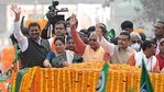 BJP leaders Dilip Ghosh and Subhendu Adhikar waves to supporters during a public rally, in Kolkata on Monday. (ANI Photo) BJP leaders Dilip Ghosh and Subhendu Adhikar waves to supporters during a public rally, in Kolkata on Monday. (ANI Photo)