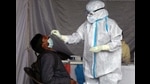 A health worker collecting samples for testing. Haryana reported 1,354 cases from January 11 to 17 as compared to 1,887 cases the week before. (HT file photo) A health worker collecting samples for testing. Haryana reported 1,354 cases from January 11 to 17 as compared to 1,887 cases the week before. (HT file photo)