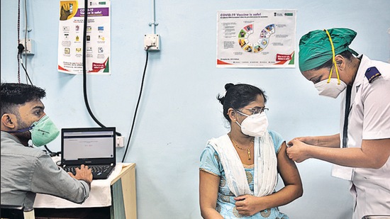 A healthcare worker being administered the vaccine shot at Rajawadi Hospital, Ghatkopar, on Monday. (Satish Bate/HT Photo)