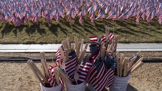Flags are ready to be placed on the National Mall ahead of the inauguration of President-elect Joe Biden and Vice President-elect Kamala Harris on January 18. Joe Biden will ascend to the presidency with an inaugural speech outlining how he’ll tackle the health and economic crises he inherits while attempting to knit the country back together,(Alex Brandon / AP)