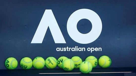 FILE PHOTO: Tennis - Australian Open - Melbourne, Australia, January 14, 2018. Tennis balls are pictured in front of the Australian Open logo before the tennis tournament. REUTERS/Thomas Peter/File Photo(REUTERS)