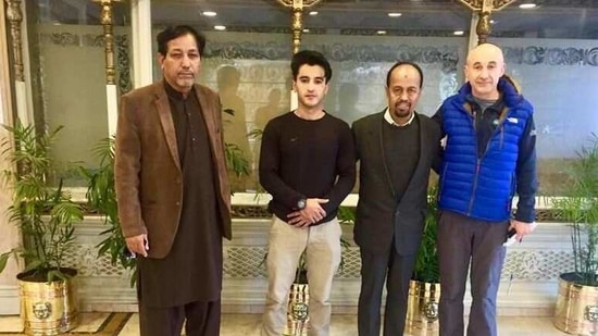 Alex Goldfarb poses for a photo with members of Alpine Club of Pakistan in Islamabad, Pakistan December 29, 2020.   Karrar Haidri/Alpine Club of Pakistan/Handout via REUTERS (via REUTERS)