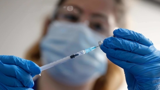 A nurse prepares a shot of the Pfizer-BioNTech Covid-19 vaccine at Guy's Hospital in London.(AP) A nurse prepares a shot of the Pfizer-BioNTech Covid-19 vaccine at Guy's Hospital in London.(AP)