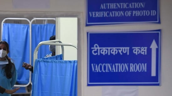Security and healthcare workers wait for the start of the Covid-19 coronavirus vaccination drive at the RML hospital in New Delhi. Security and healthcare workers wait for the start of the Covid-19 coronavirus vaccination drive at the RML hospital in New Delhi.