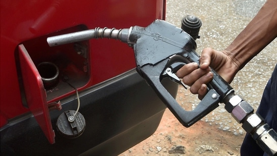 An attendant at a fuel station fills fuel in a vehicle in Kolkata. (PTI) An attendant at a fuel station fills fuel in a vehicle in Kolkata. (PTI)