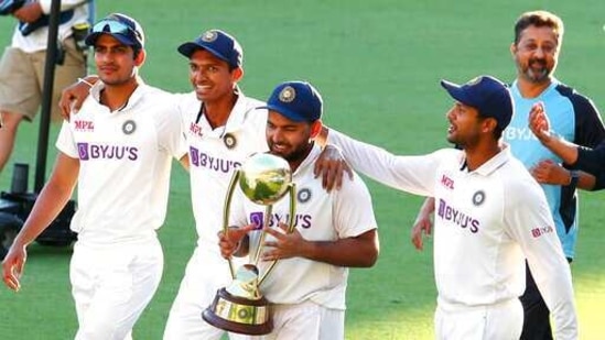 India's Rishabh Pant carries the trophy as he celebrates with his teammates after defeating Australia by three wickets on the final day of the fourth cricket test at the Gabba, Brisbane, Australia, Tuesday, Jan. 19, 2021.India won the four test series 2-1. (AP) India's Rishabh Pant carries the trophy as he celebrates with his teammates after defeating Australia by three wickets on the final day of the fourth cricket test at the Gabba, Brisbane, Australia, Tuesday, Jan. 19, 2021.India won the four test series 2-1. (AP)