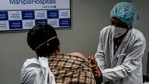 A medical worker (R) inoculates a medical staff with a Covid-19 Coronavirus vaccine at the Manipal Hospital, in New Delhi on January 19, 2021.(AP) A medical worker (R) inoculates a medical staff with a Covid-19 Coronavirus vaccine at the Manipal Hospital, in New Delhi on January 19, 2021.(AP)