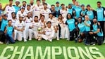 Indian players pose with the winning trophy after defeating Australia by three wickets on the final day of the fourth cricket test match at the Gabba, Brisbane, Australia, (PTI)