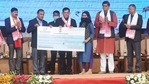 Assam Chief Minister Sarbananda Sonowal (fourth from right) handing over a cheque to a beneficiary of Re-SVAYEM at an event in Guwahati on Wednesday. (Twitter/Himanta Biswa Sarma) Assam Chief Minister Sarbananda Sonowal (fourth from right) handing over a cheque to a beneficiary of Re-SVAYEM at an event in Guwahati on Wednesday. (Twitter/Himanta Biswa Sarma)