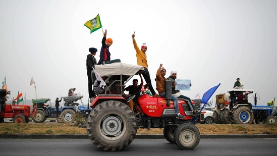 Farmers participate in a tractor rally to protest against the newly passed farm bills at Singhu border near New Delhi.(REUTERS)