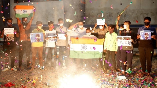 Fans light fireworks to celebrate Team India's victory in Brisbane, at sports complex in Ahmedabad on Tuesday. (Reuters Photo)