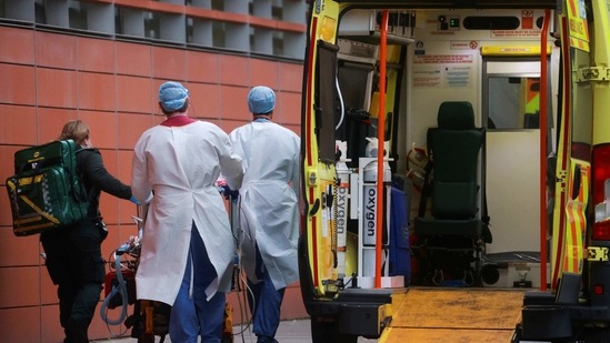 Health care workers transport a patient at the Royal London Hospital, as the spread of the coronavirus disease (Covid-19) continues, in London, Britain(REUTERS) Health care workers transport a patient at the Royal London Hospital, as the spread of the coronavirus disease (Covid-19) continues, in London, Britain(REUTERS)